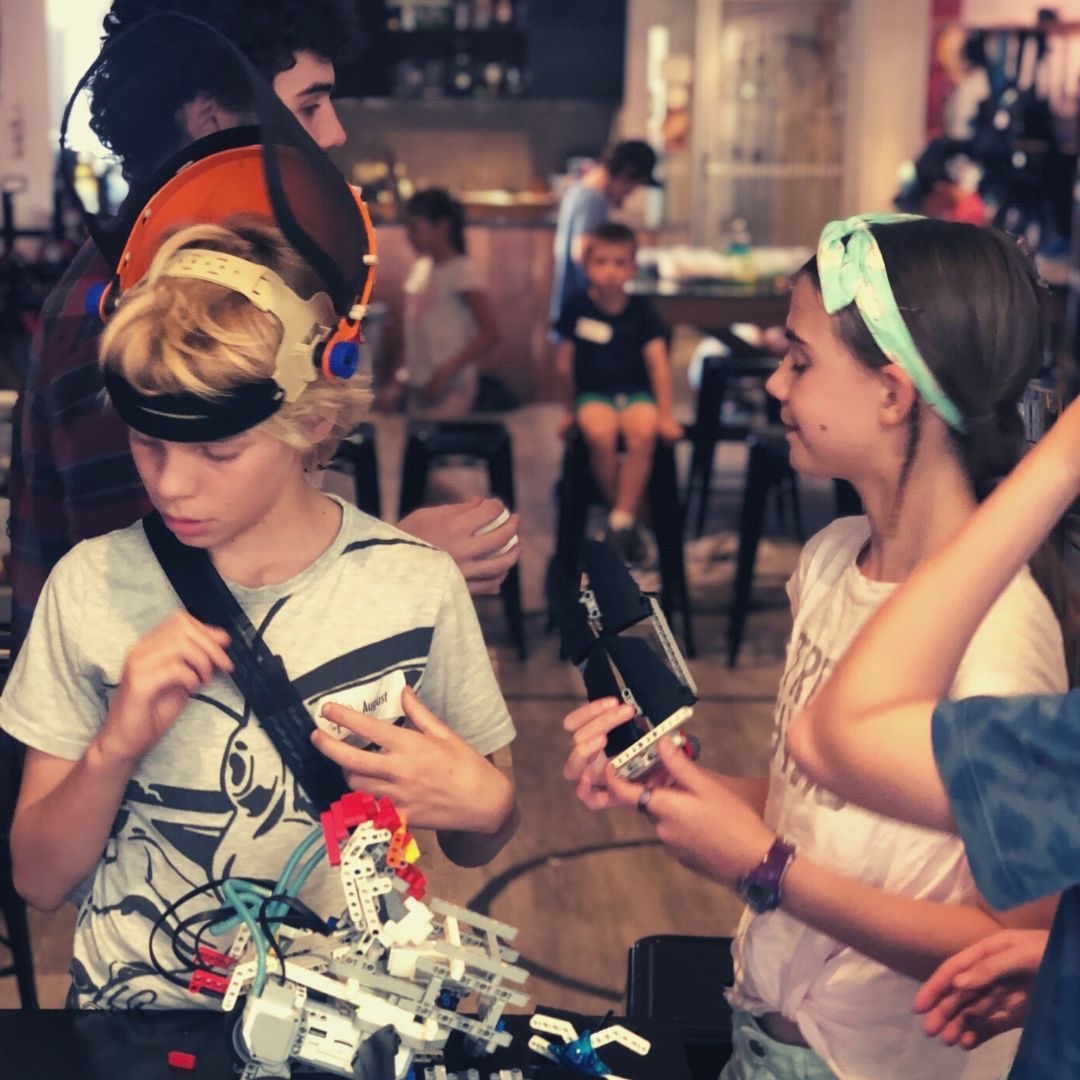 TinkerTank Academy students actively engaged in hands-on building and experimentation